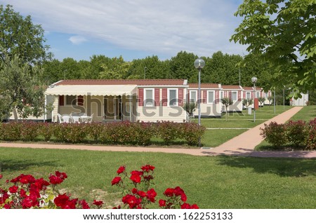 camping site with rows of identical mobil homes