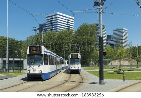 AMSTERDAM - JUNE 30: Tram station on june 30, 2013 in amsterdam. GVB provides public transport with tram, bus, metro and ferry in and around Amsterdam and employs approximately 3,750 employees.