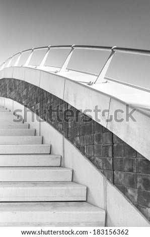stairs with railing on a bridge in monochrome colors