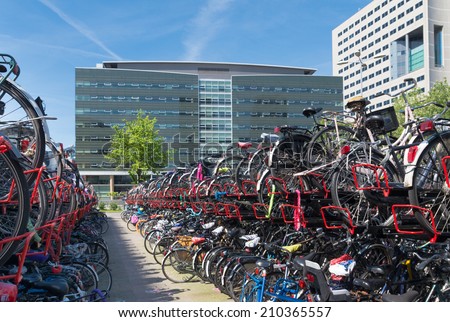 UTRECHT, NETHERLANDS - MAY 17, 2014: bicycle parking at the utrecht central station. As the largest train station in the netherlands, the bicycle parking is a main problem in the city