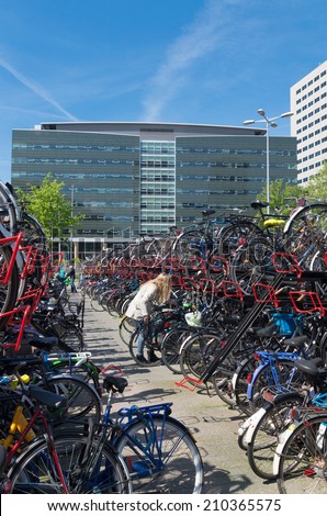 UTRECHT, NETHERLANDS - MAY 17, 2014: bicycle parking at the utrecht central station. As the largest train station in the netherlands, the bicycle parking is a main problem in the city