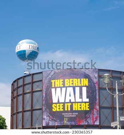 BERLIN - JULY 29, 2014: The asisi Panorama - The Wall on a divided Berlin by the artist Yadegar Asisi at Checkpoint Charlie. It shows a panorama of the daily routine on both sides of the Berlin Wall