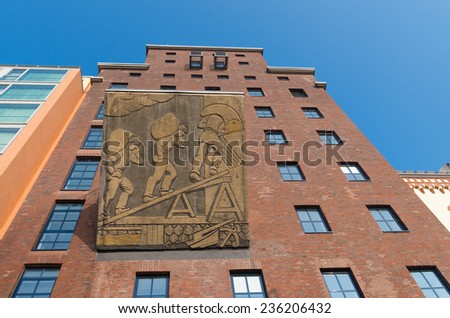 DUSSELDORF - SEPTEMBER 6, 2014: Restored factory building in the media harbor. The Hafen district contains some spectacular post-modern architecture, but also some bars, restaurants and pubs