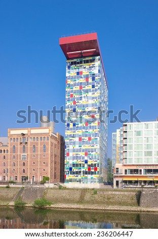 DUSSELDORF - SEPTEMBER 6, 2014: Modern office buildings in the media harbor. The Hafen district contains some spectacular post-modern architecture, but also some bars, restaurants and pubs