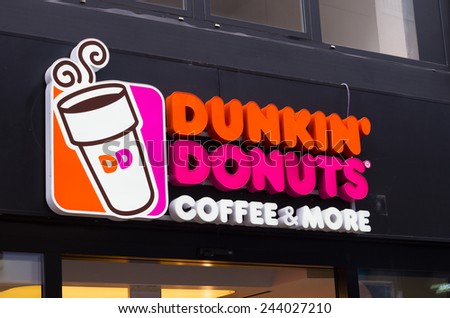 ESSEN, GERMANY - SEPTEMBER 14, 2014: Dunkin\' donuts sign. Since its founding, the company has grown to become one of the largest coffee and baked goods chains in the world, with 11,000 restaurants.