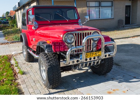 OLDENZAAL, NETHERLANDS - OCTOBER 19, 2014: Jeep wrangler with bull bar. The production of the Wrangler began in 1987 and was succeeded in 1997 and 2007 by a second and a third generation, respectively