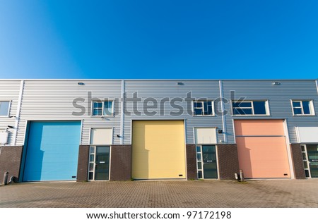 business units for small companies with colorful roller doors