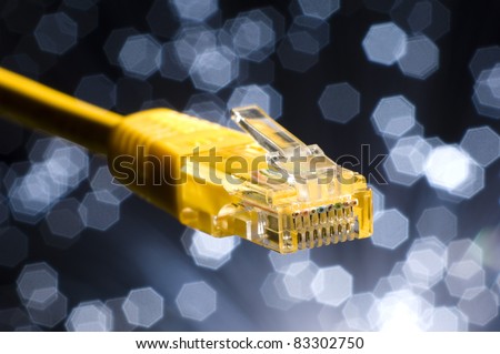 Ethernet cable on a dark blue Illuminated fiber background. There is a sign that indicates that over 1 meter.