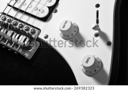 Black and White  close up of electric guitar volume knob.  Please note that this is a player\'s guitar, not a museum piece