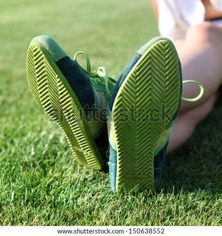 green sole of shoes on grass, gymnastics