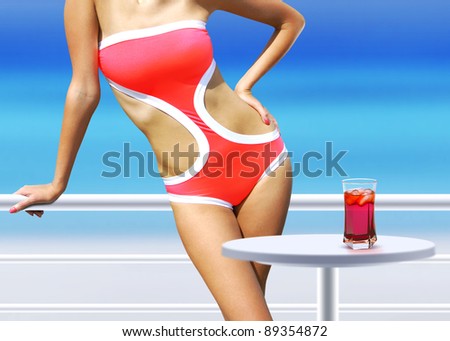 part of woman with cocktail near swimming pool