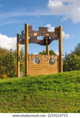 Children's play activity frame in public park with bright blue sky. Foto stock © 