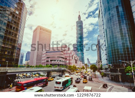 Dawn view of a pedestrian footbridge over a busy street corner in Taipei City with Taipei 101 Tower and World Trade Center in Xinyi District ~ Beautiful scenery of Taipei Downtown at rush hour 商業照片 © 