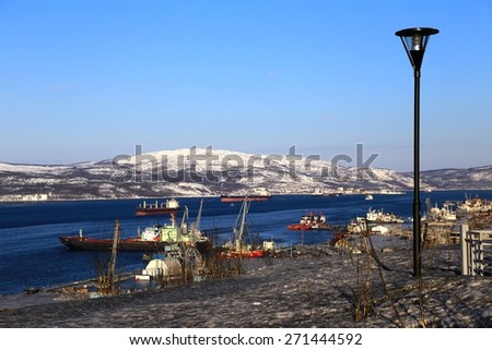 Murmansk. View of Kola bay with ships and snow hills in the bright, sunny winter day