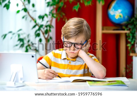 Similar – Image, Stock Photo Boy sits in front of green wall and grins