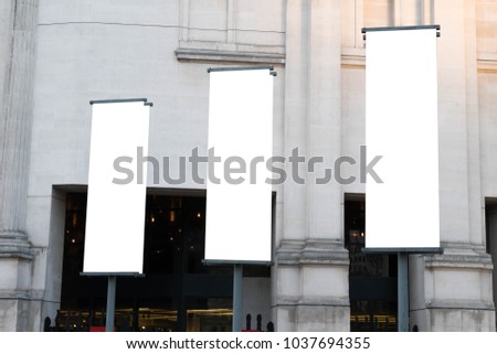 Similar – Image, Stock Photo Three flags in white, grey and blue flutter merrily on a rope, tied in the wind, in front of a red canvas tarpaulin at an event.