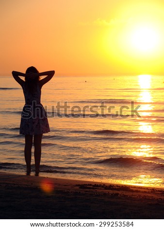 Relaxed girl looking at the sunrise