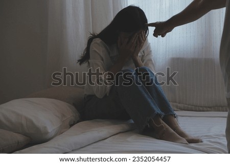 Upset woman having a fight with a man at home. Hispanic wife slapping the face of her husband during an argument because of their relationship problems Stock fotó © 