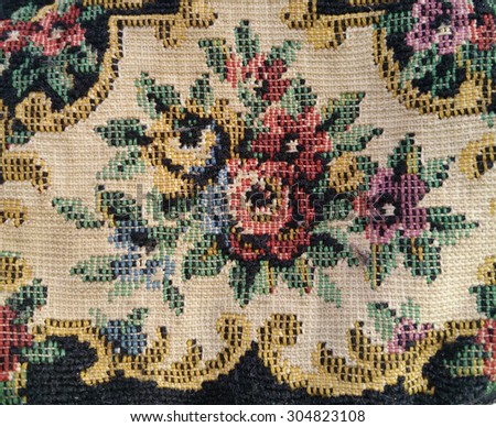 Close up of a Vintage Spanish handmade embroidered fabric purse with floral ornament