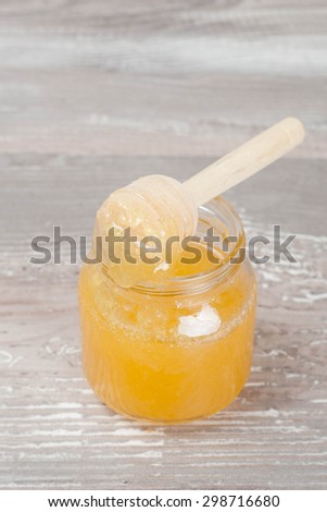 Jar of Honey with Honey Dipper, vertical