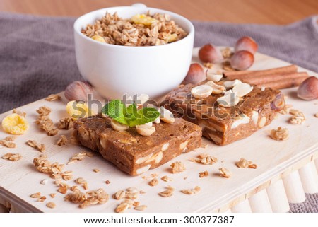 nut bar on wooden board, close-up, horizontal