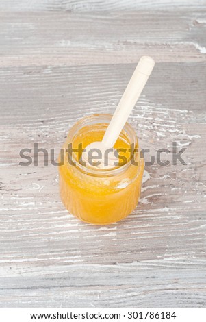 Jar of Honey with Honey Dipper, close up