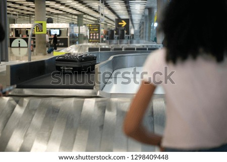 Similar – Image, Stock Photo Anonymous girl in airport terminal