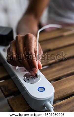 Image, Stock Photo Crop ethnic person recharging device