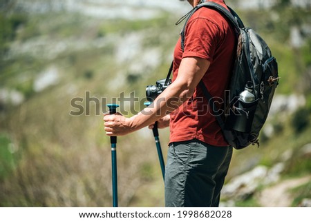 Similar – Image, Stock Photo Unrecognizable hiker observing wild valley from rocky cliff
