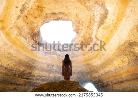 Similar – Image, Stock Photo Anonymous female tourist standing on rocky seashore and taking photos
