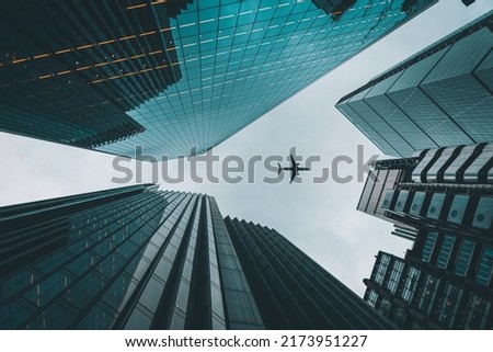 Similar – Image, Stock Photo Office buildings reflected over an urban glass facade