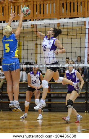 KAPOSVAR, HUNGARY - MAY 18: Zsofia Horvath (L) in action at the final of the hungarian junior championship (Kaposvar blue vs. Ujpest white) , May 18, 2012 in Kaposvar, Hungary