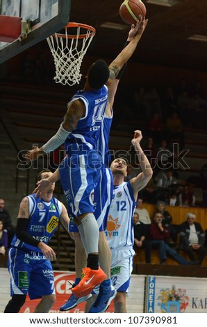 0KAPOSVAR, HUNGARY - FEBRUARY 22: Unidentified players in action at a Hungarian Cup basketball game with Kaposvar (white) vs. Fehervar (blue) on February 22, 2012 in Kaposvar, Hungary.