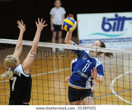 KAPOSVAR, HUNGARY - FEBRUARY 7: Timea Kondor strikes the ball in the Hungarian Extra League woman volleyball game between Kaposvar and UTE Volley , February 7, 2009 in Kaposvar, Hungary.
