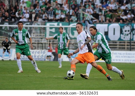 KAPOSVAR, HUNGARY - AUGUST 29: Unidentified soccer players in action at Hungarian National Championship soccer game Kaposvar vs Ferencvaros August 19, 2009 in Kaposvar, Hungary.