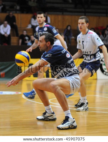 KAPOSVAR, HUNGARY - JANUARY 31:Kantor (with the ball) receives the ball at a Middle European League volleyball game Kaposvar (HUN) vs. Mladost Zagreb (CRO), January 31, 2010 in Kaposvar, Hungary.