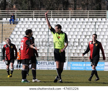 KAPOSVAR, HUNGARY - FEBRUARY 27: The referee presents the red card for Diego (19) at a Hungarian National Championship soccer game Kaposvar vs Budapest Honved February 27, 2010 in Kaposvar, Hungary.