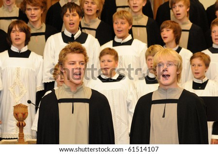 KAPOSVAR, HUNGARY - AUGUST 26: Members of the St Michael\'s boys Choir (EST) sing at the IV. Pannonia Cantat Youth Choir Festival August 26, 2010 in Kaposvar, Hungary