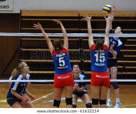 KAPOSVAR, HUNGARY - MARCH 3: Alexandra Horvath (R) strikes the ball at the Hungarian Cup woman volleyball game Kaposvar vs. Vasas, March 3, 2007 in Kaposvar, Hungary.