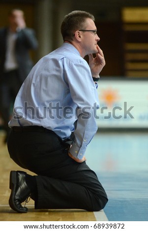 KAPOSVAR, HUNGARY - JANUARY 12: Imre Horvath (Paks trainer) in action at a Hugarian Cup basketball game Kaposvar vs. Paks January 12, 2011 in Kaposvar, Hungary.