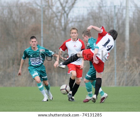 KAPOSVAR, HUNGARY - MARCH 13: Viktor Szepesi (L) in action at the Hungarian National Championship under 19 game between Kaposvar and Mohacs on March 13, 2011 in Kaposvar, Hungary.
