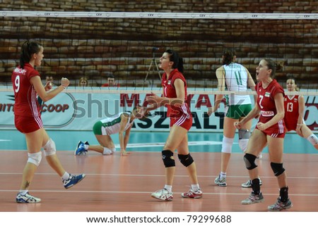 SZOMBATHELY, HUNGARY - JUNE 4: Hungarian players celebrate at a CEV European League woman\'s volleyball game Hungary vs Bulgaria on June 4, 2011 in Szombathely, Hungary.