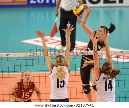DEBRECEN, HUNGARY - JULY 9: Rita Liliom (in black 1) in action a CEV European League woman\'s volleyball game Hungary (black) vs Israel (white) on July 9, 2011 in Debrecen, Hungary.