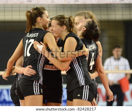 DEBRECEN, HUNGARY - JULY 9: Hungarian players celebrate at a CEV European League woman\'s volleyball game Hungary (black) vs Israel (white) on July 9, 2011 in Debrecen, Hungary.