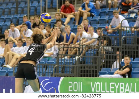 DEBRECEN, HUNGARY - JULY 9: Zsuzsanna Jozsa (in black 4) in action at a CEV European League woman\'s volleyball game Hungary (black) vs Israel (white) on July 9, 2011 in Debrecen, Hungary.