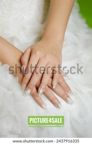 Similar – Image, Stock Photo Bride shows her beautiful lace wedding garter.