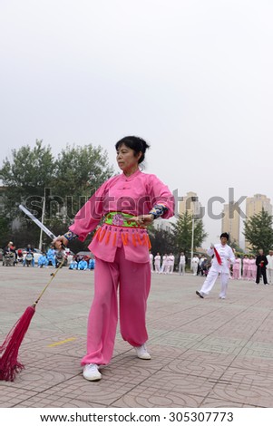 Luannan - September 20: a woman fencing in cultural activities square, the performance on September 20, 2014, the south of the luanhe river, hebei, China.