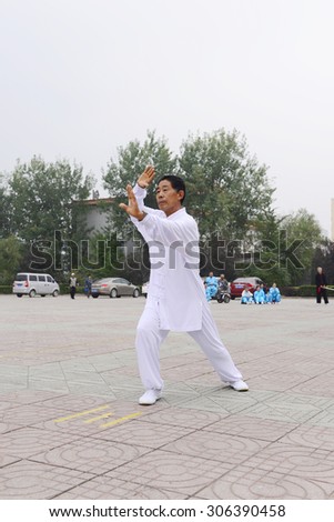 Luannan - September 20: tai chi performance in cultural activities square, on September 20, 2014, the south of the luanhe river, 
hebei, China.