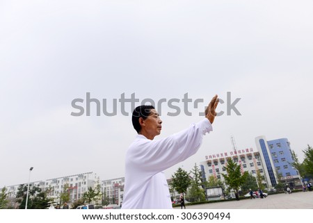 Luannan - September 20: tai chi performance in cultural activities square, on September 20, 2014, the south of the luanhe river, \
hebei, China.