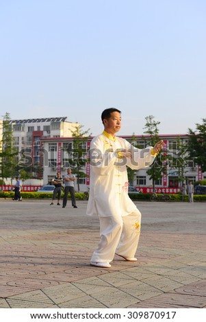 Luannan - June 14: tai chi man individual performances in literary style center square, on June 14, 2014, luannan county, hebei province, China.